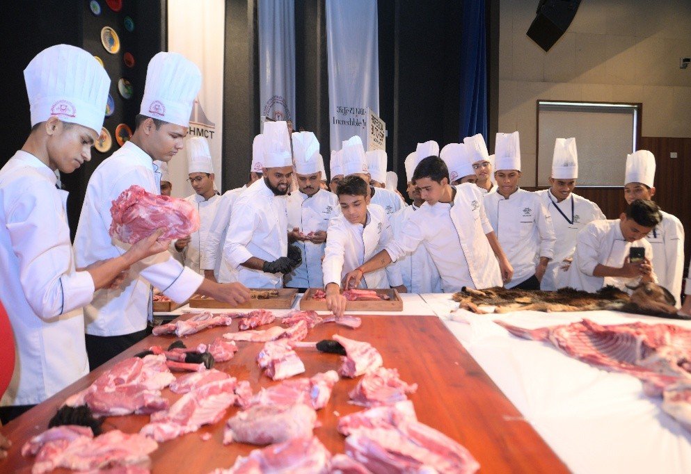 Students gathered around the butchery table